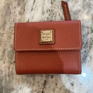 Dooney and Bourke burnt orange wallet.  Color is more like British tan